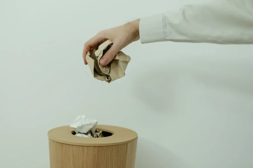 A Realtor discarding a list of leads due to poor quality