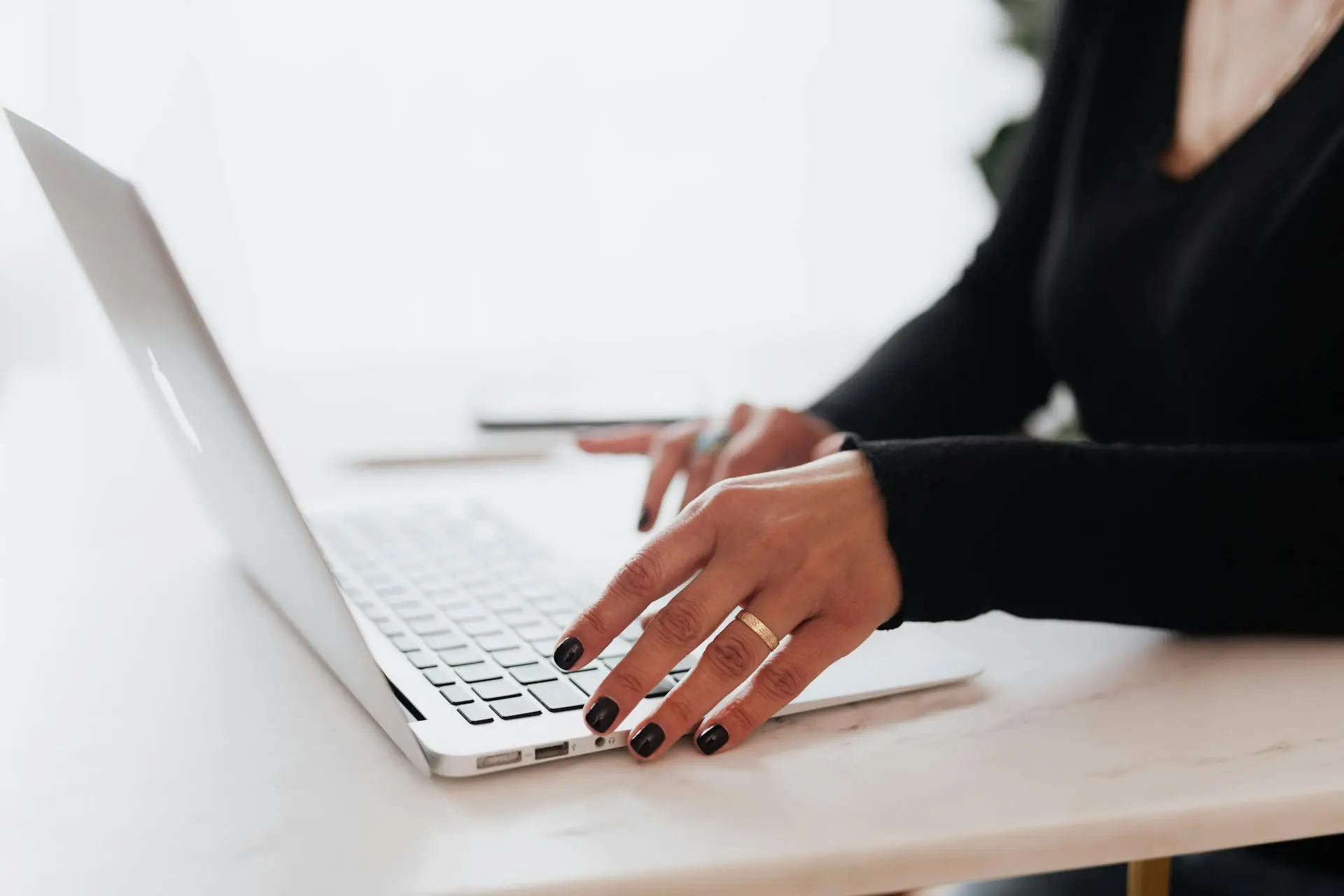 A realtor sending an email newsletter to clients
