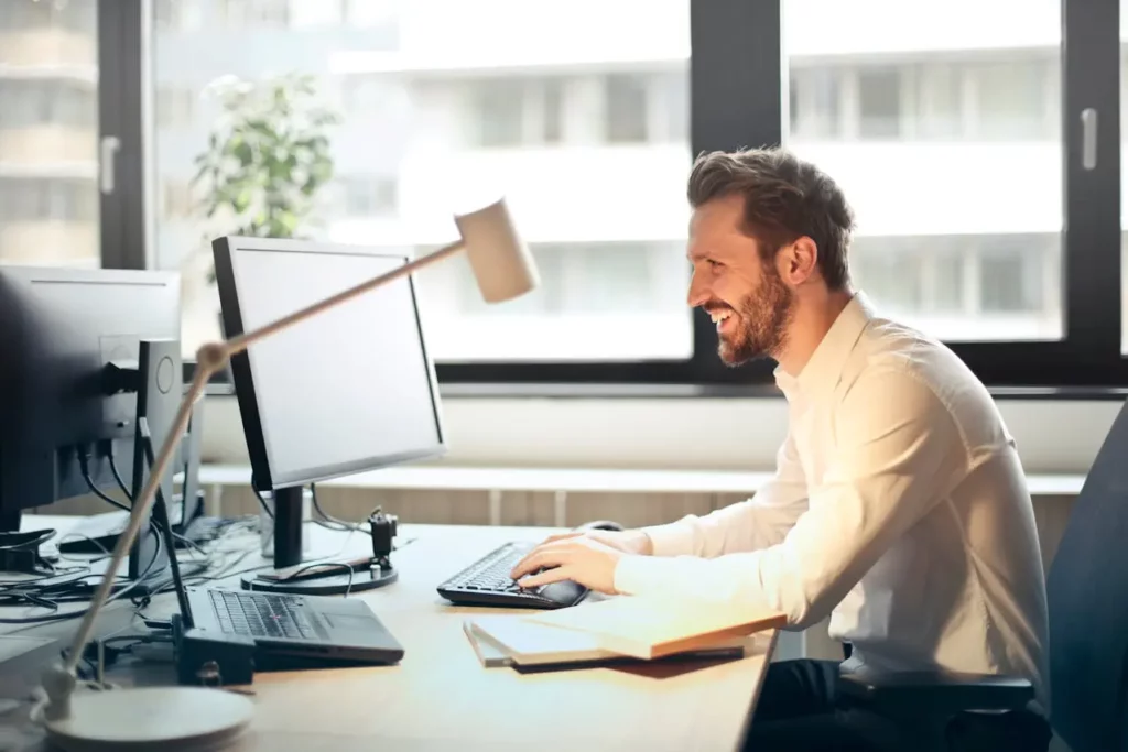 Real estate agent reviewing automated property update emails