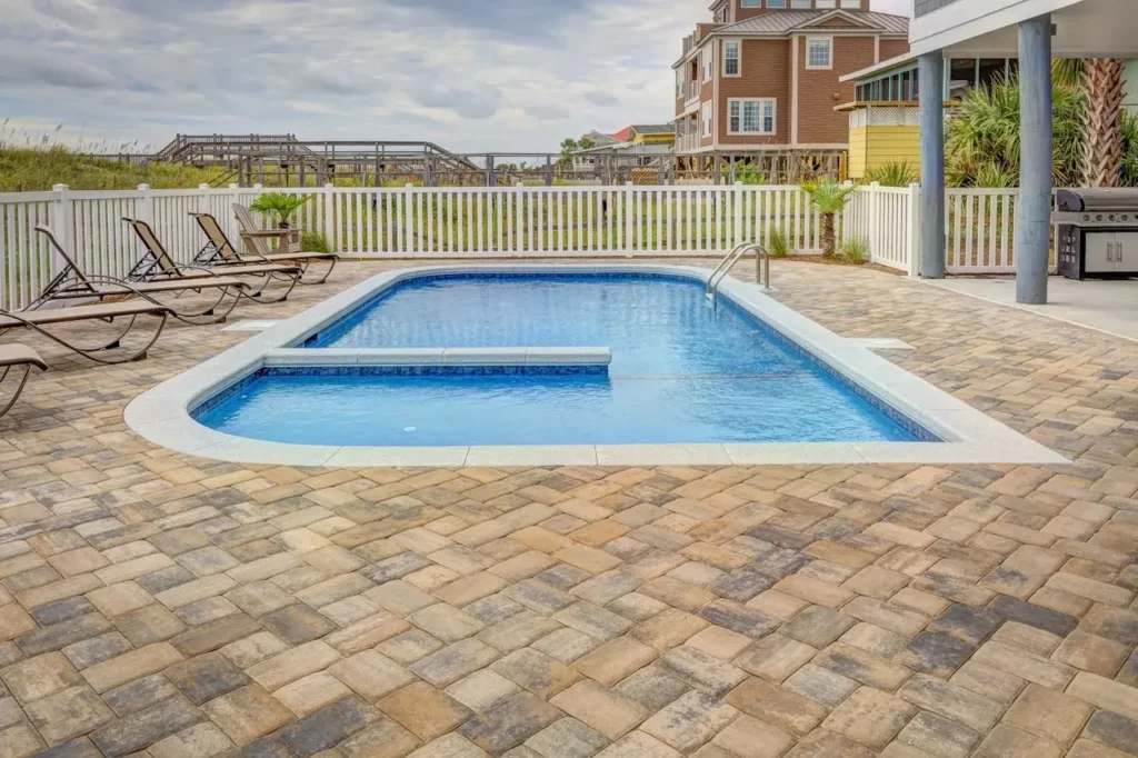 A backyard with a pool perfect for summer entertaining