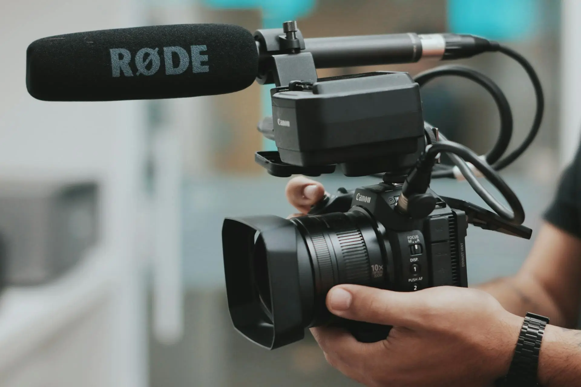 A professional videographer filming a real estate property listing