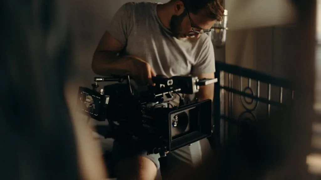 Videographer setting up equipment in a home for a real estate shoot