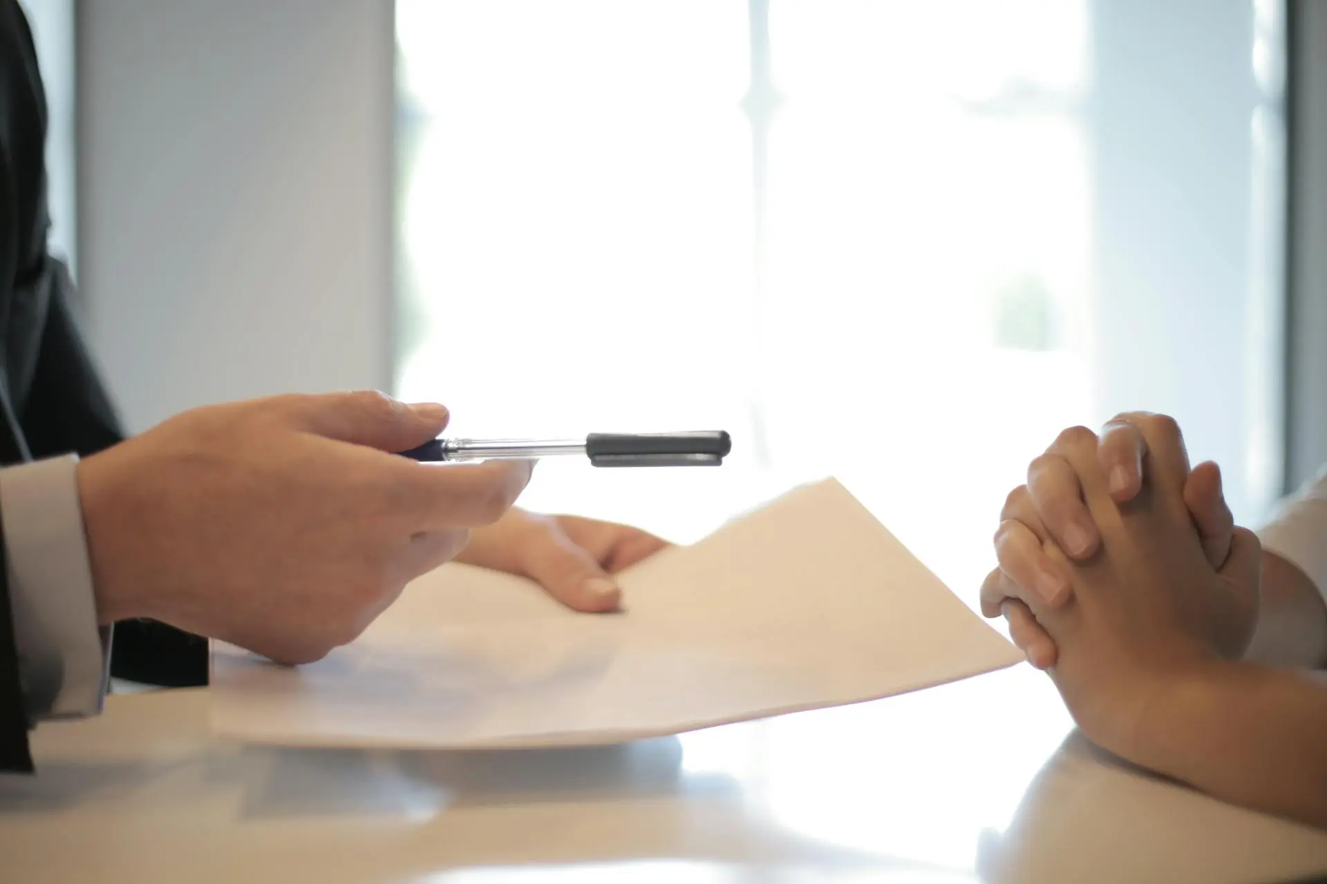 A real estate agent showing a satisfied client how to leave a Google review