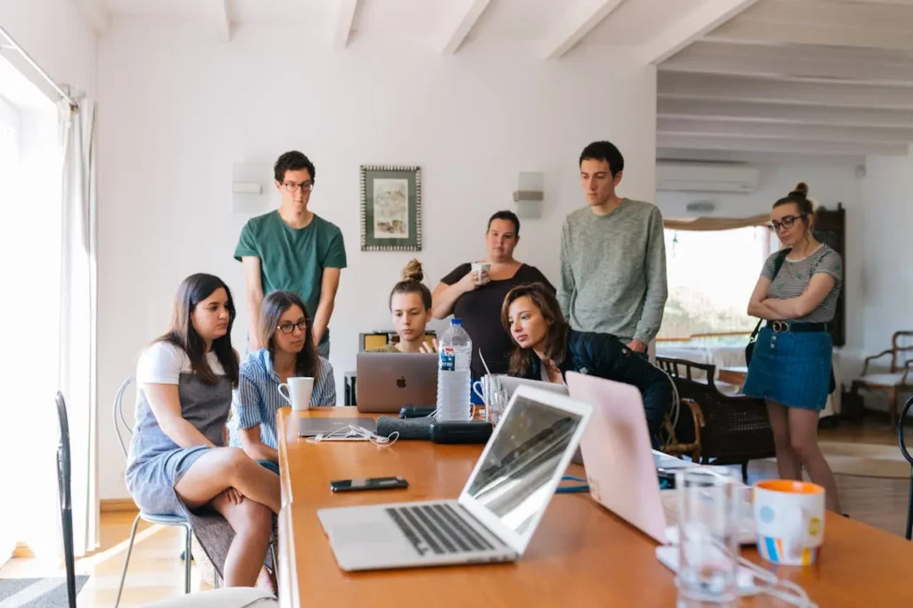 A real estate team collaborating with a marketing expert.
