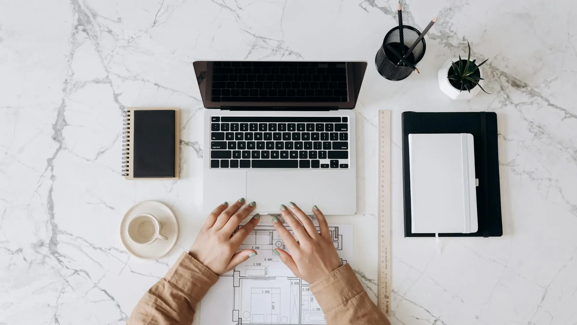 A realtor reviewing automated marketing reports while preparing for a client meeting