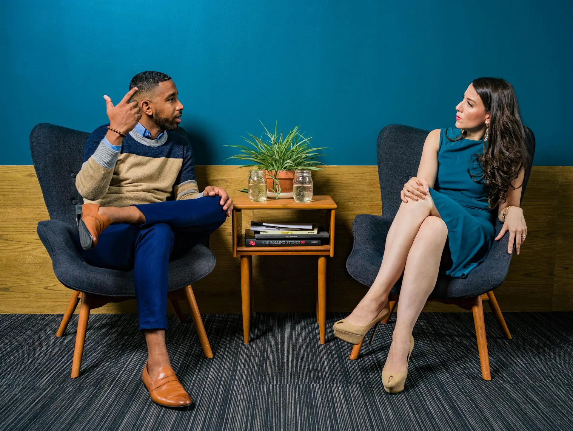 A real estate agent discussing video production with a professional videographer